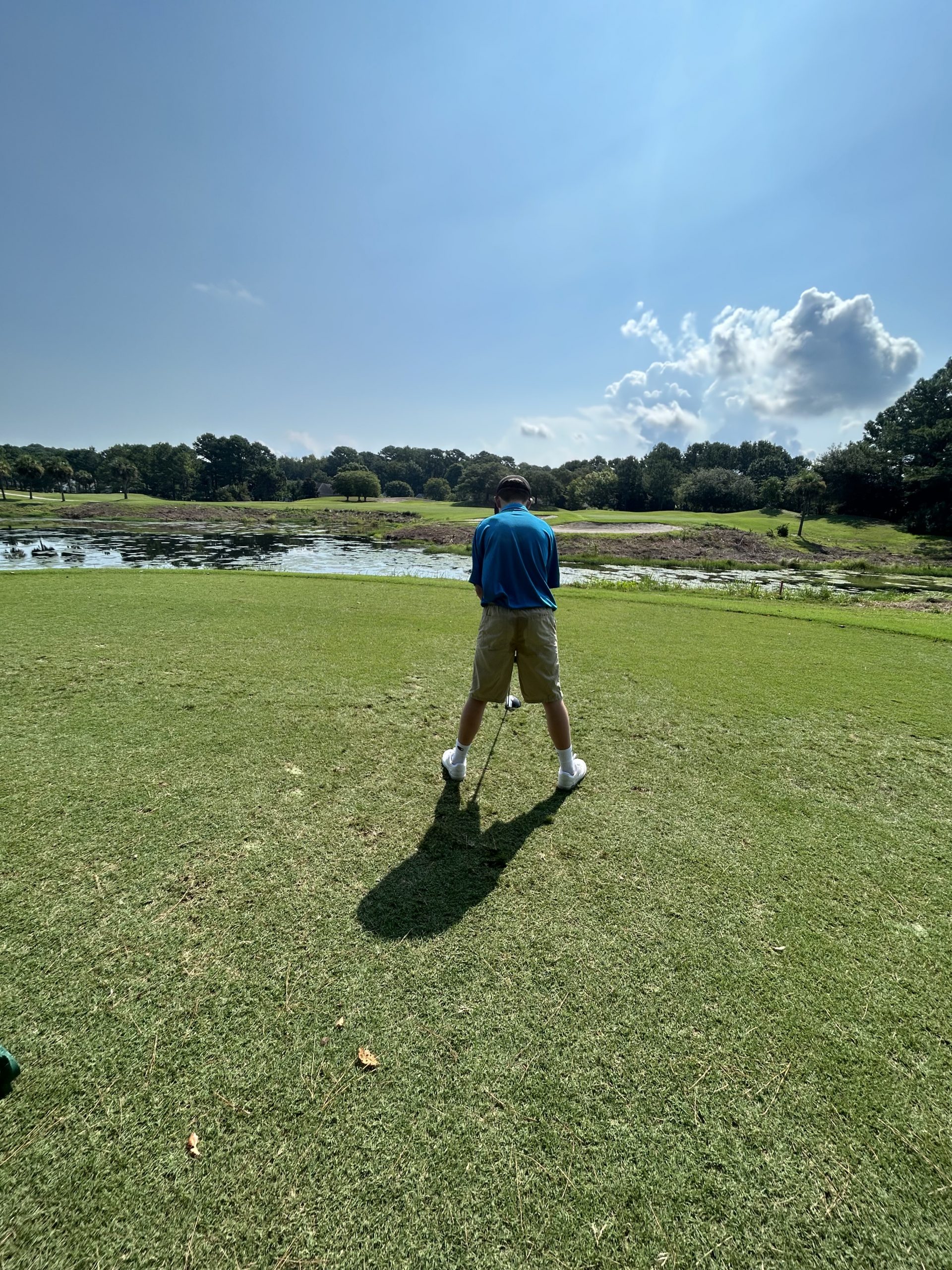 Image of man playing golf